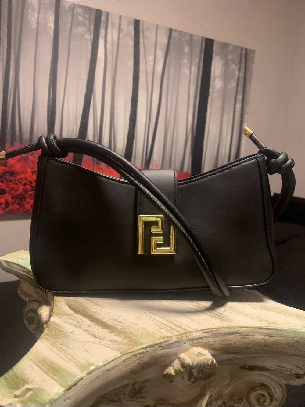 Black Shoulder Bag with Gold Accent and Adjustable Strap